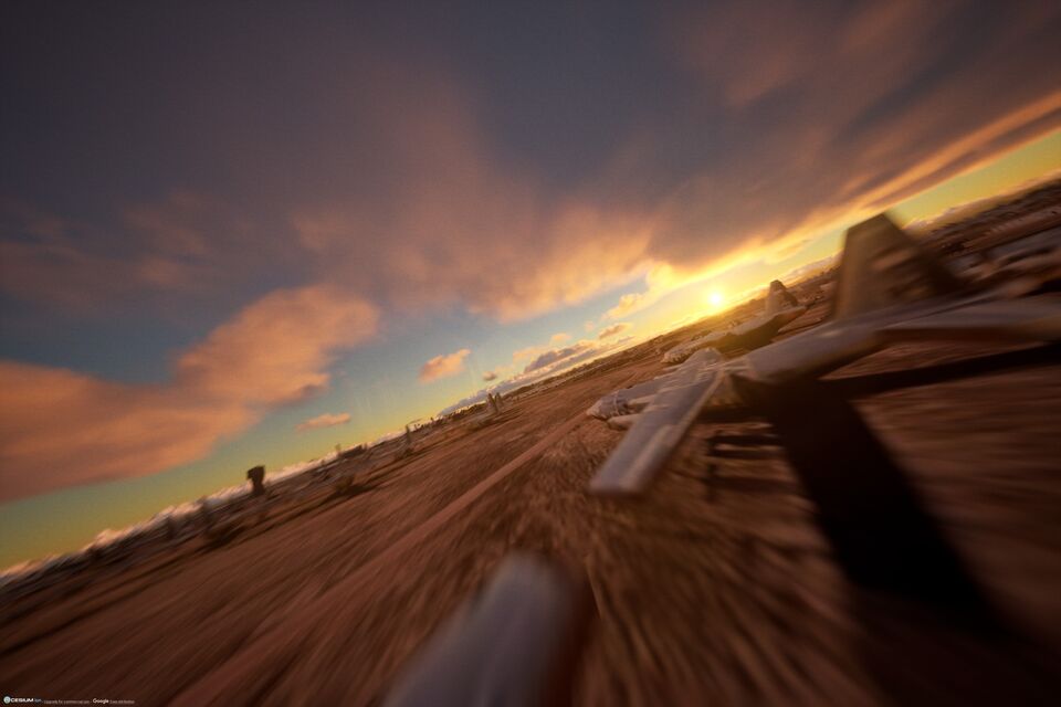 Sunset over a desert with long cloud shadows